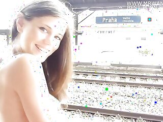 German babe strips down at the train stop