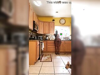 Big booty babe cleans kitchen while getting naked